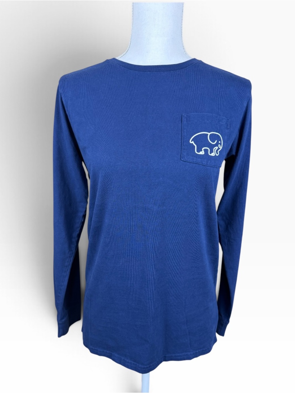Ivory Ella Women’s Long Sleeve Pocket Tee in Royal Blue with Elephant Logo.